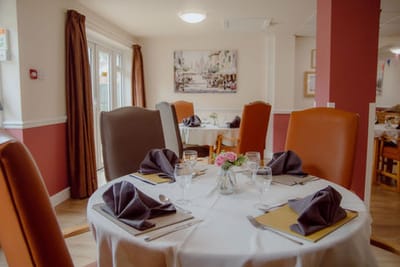 Dining area set up with decorated table.