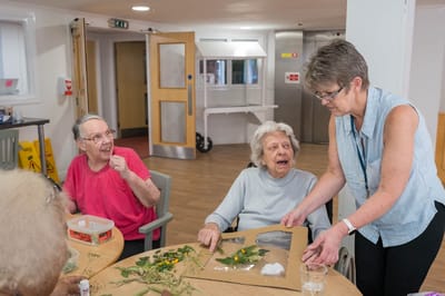 Residents engaged in an arts and crafts activity