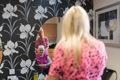 Resident getting a haircut in a salon