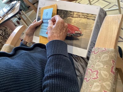 Resident engaging with printed photos.