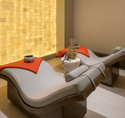 Spa area with lounge chairs and candles