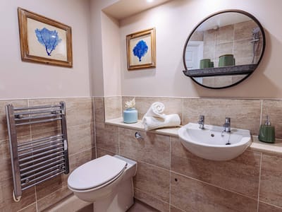 Clean and modern bathroom with decorative elements.