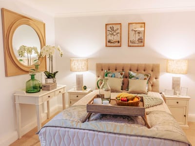 Stylish private room with decor and fruit tray.