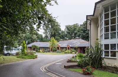 Outdoor view of the facility with gardens and pathways.
