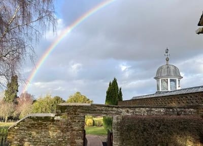 Rainbow over the facility's outdoor garden space