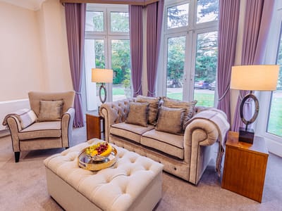 Cozy lounge area with seating and lamps