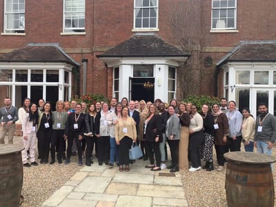 Group of staff members posing outdoors