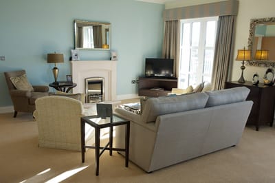 Cozy common area with comfortable seating and a fireplace.