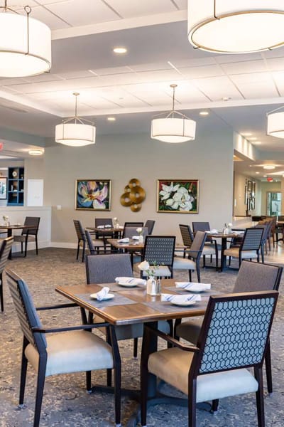 Elegant dining room with tables and artwork