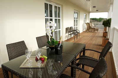 Outdoor dining area with table and decorations