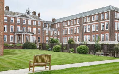 Outdoor view of the facility's building and garden