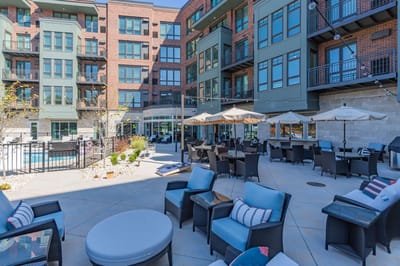 Outdoor seating area with umbrellas and furniture