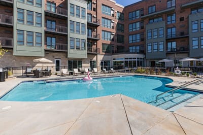 Outdoor swimming pool area with lounge chairs