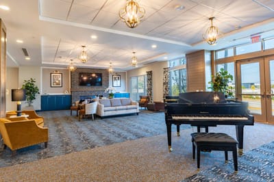 Bright interior lounge with piano and seating areas
