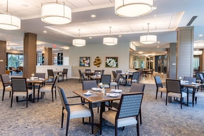 Modern dining area with tables and chairs
