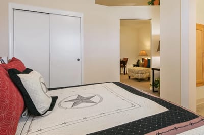 Cozy bedroom setup with star-patterned quilt