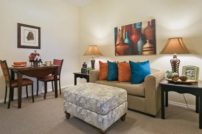 Cozy living area with decorative accents and dining table.