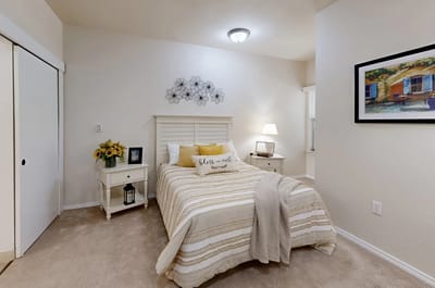 Cozy resident bedroom with decorative touches.