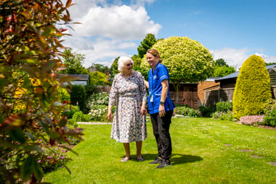 Staff and resident enjoying the garden area