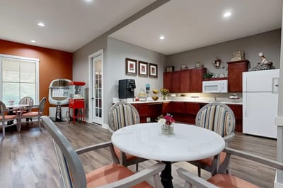 Dining area with a table and kitchenette