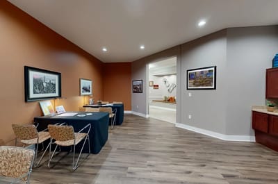 Interior common area with artwork and seating.