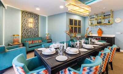 Stylish dining area with elegant decor and table setting.