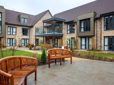 Outdoor seating area with surrounding gardens