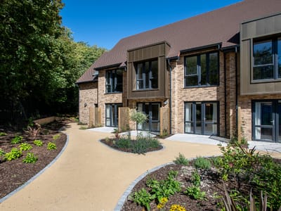 Exterior view of Cambridge Grove with landscaped garden