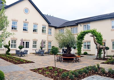Outdoor courtyard with seating and decorative elements.