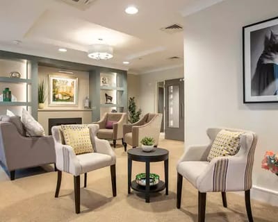 Cozy common area with seating and artwork.