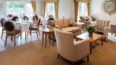 Cozy common area with seating and dining setup.