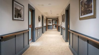 Quiet hallway with framed artwork