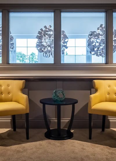 Cozy seating area with yellow chairs and decor
