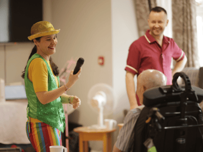 Entertainer performing for residents in a common area