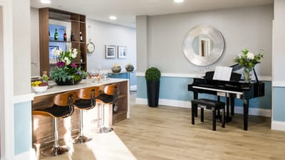 Interior common area with piano and seating
