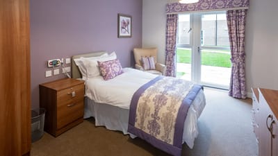Cozy resident room with purple decor
