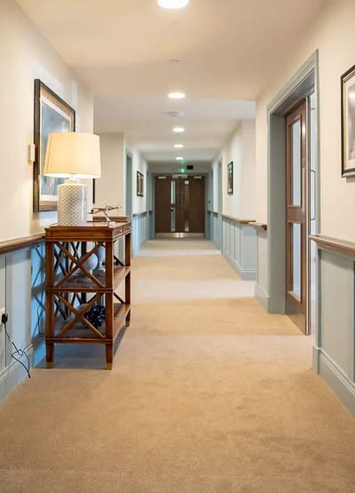 Well-lit hallway in a senior care facility