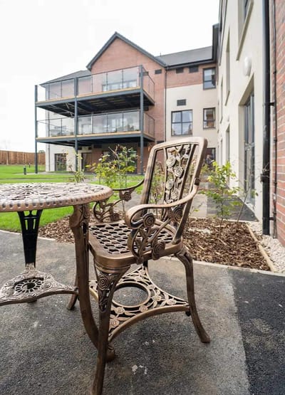 Outdoor seating area with ornate chairs