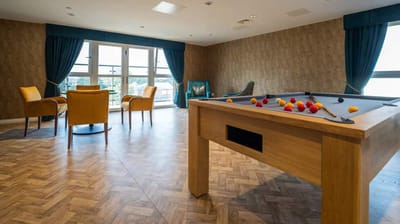 Recreation room with a pool table and seating area