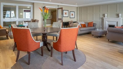 Lounge area with comfortable seating and decorative plants.
