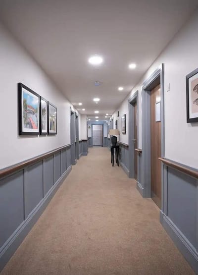 Empty hallway with artwork on walls