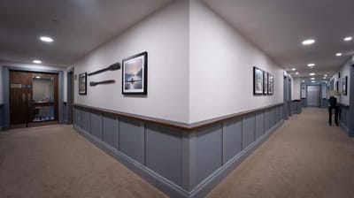 Interior hallway with framed photos and decor