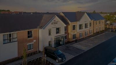 Exterior view of Escan Manor building