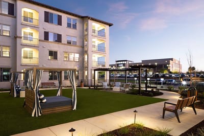 Outdoor courtyard with seating and swings