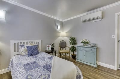 Comfortable private room with bed and chair