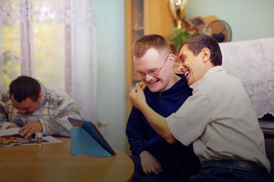 Residents laughing and enjoying an interactive moment.