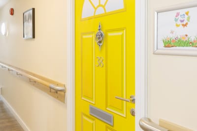 Bright yellow door in a hallway