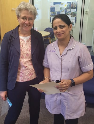 Staff member with a resident in a common area