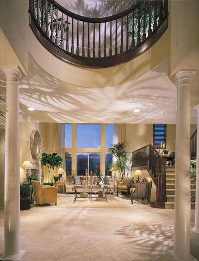 Elegant lobby area with seating and plants.
