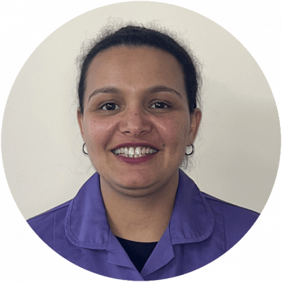 Staff member smiling in uniform